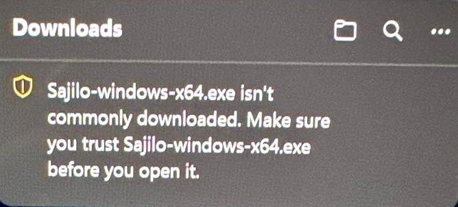 Edge's Downloads panel: “Sajilo-windows-x64.exe isn't commonly downloaded. Make sure you trust Sajilo-windows-x64.exe before you open it.”
